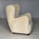 Fauteuil danois des années 1960, en véritable peau de mouton "Canberra", retapissé.
