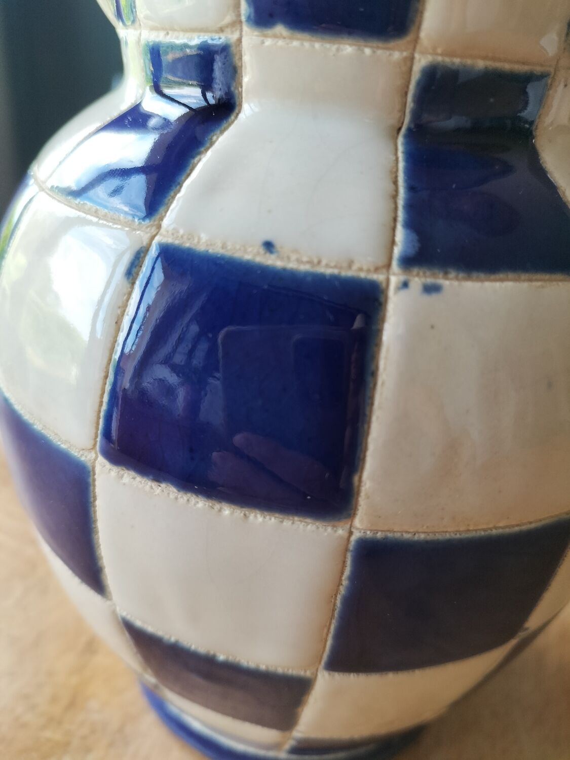 Blue and white checkerboard water pitcher