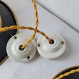 Duo of suspensions in enamelled sheet metal