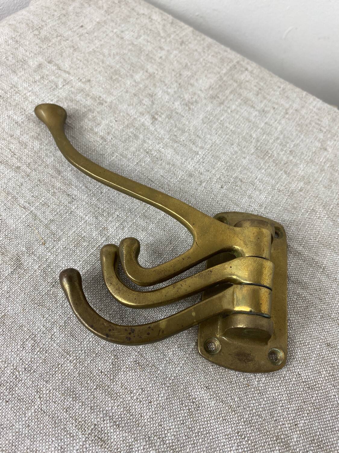 Three-pronged folding brass coat hook