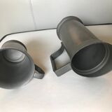 Set of 2 pitchers in tin