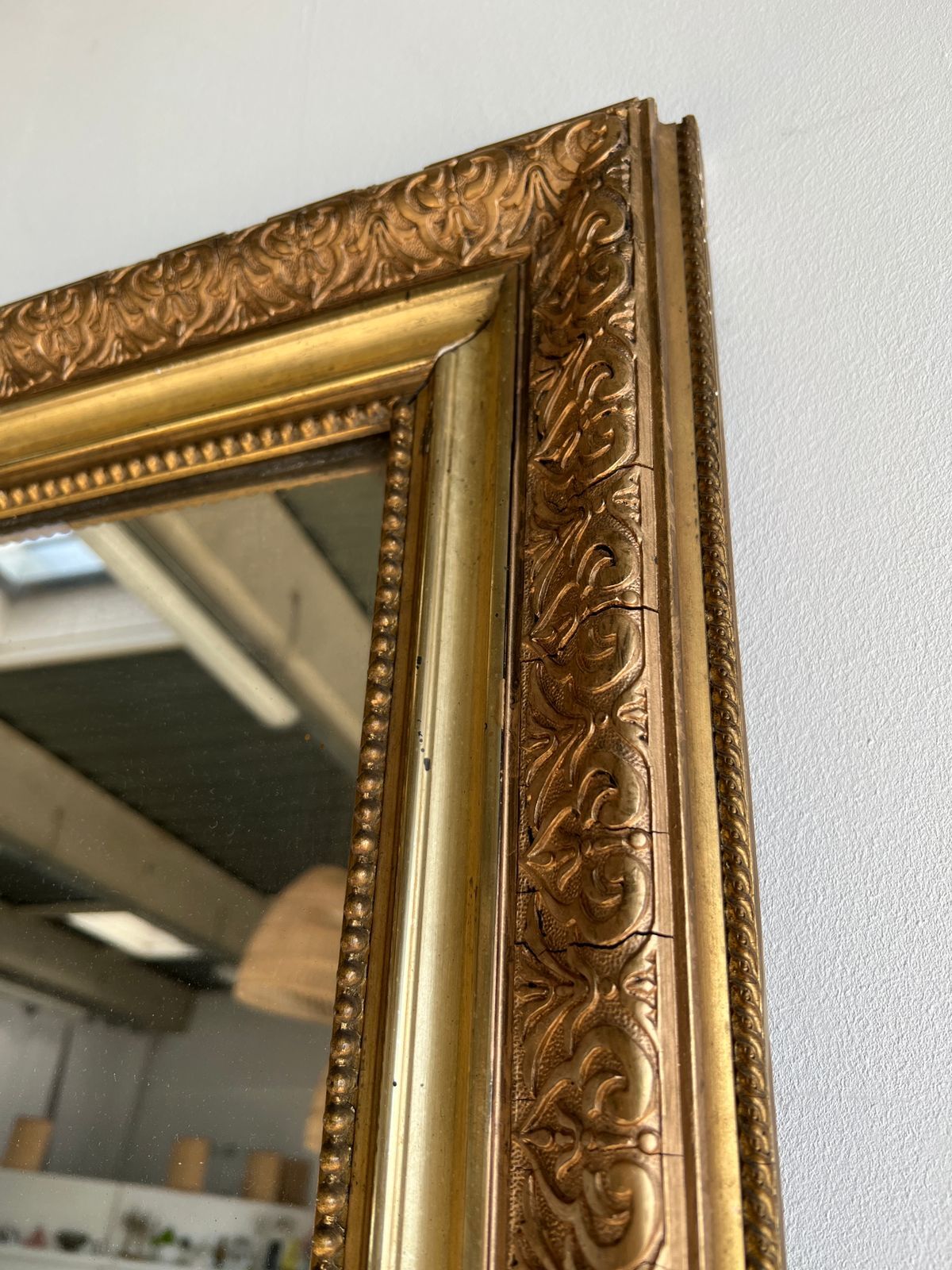 Gilded mirror with frieze h2m10 l:73cm