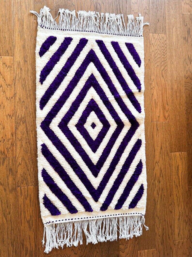 Handmade wool rug from Moroccan Atlas, size 140 x 260 cm.