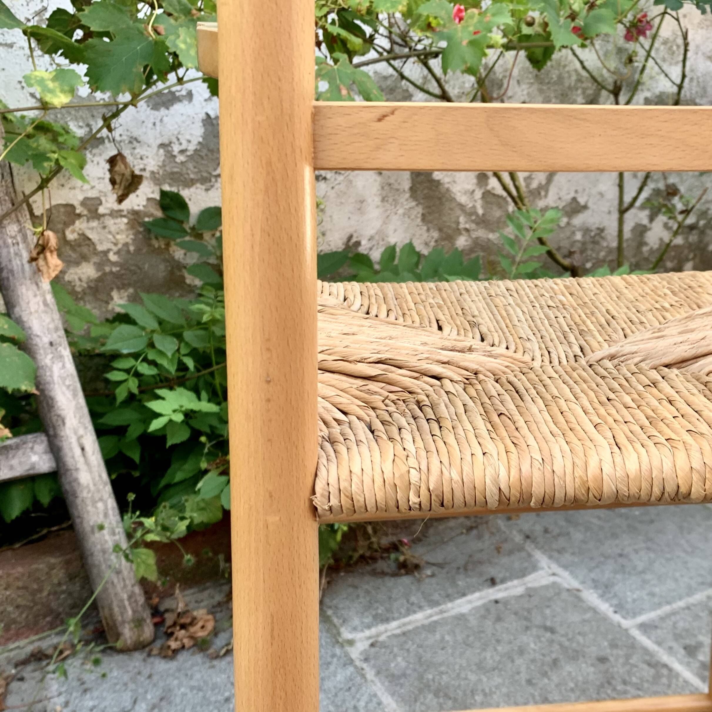 Old wooden and straw high chair for children