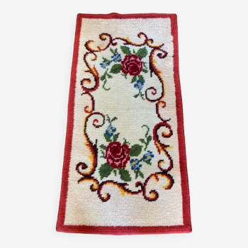 Vintage wool rug with floral decor