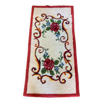 Vintage wool rug with floral decor