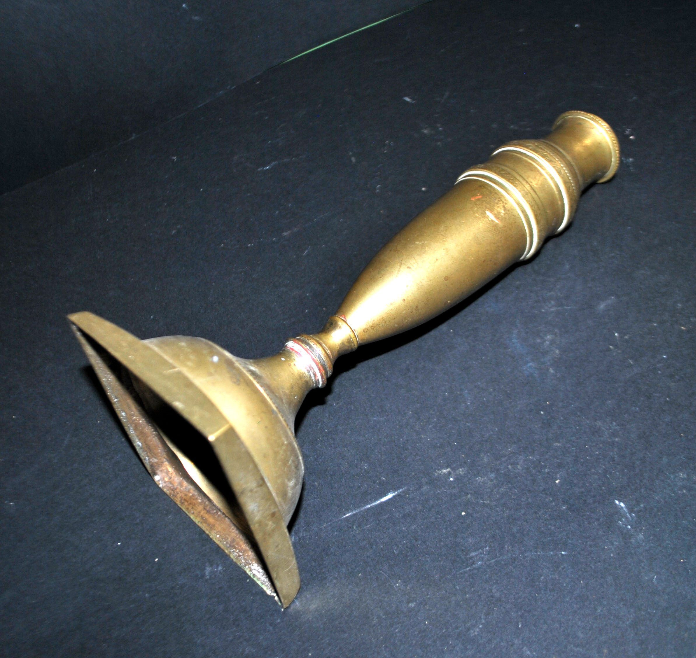 Antique baluster candlestick in bronze with hand-chiseled design.