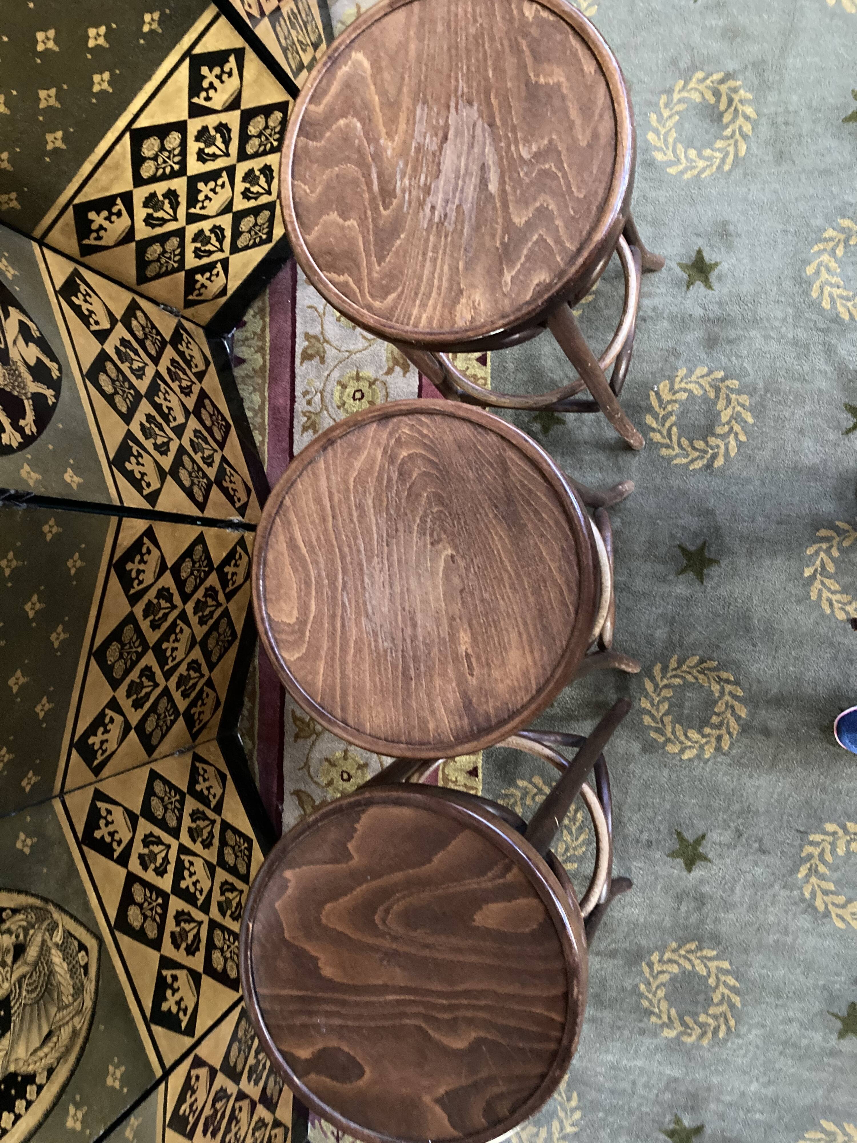 3 curved wooden bar stools