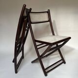 Set de quatre chaises pliantes en bois et cannage