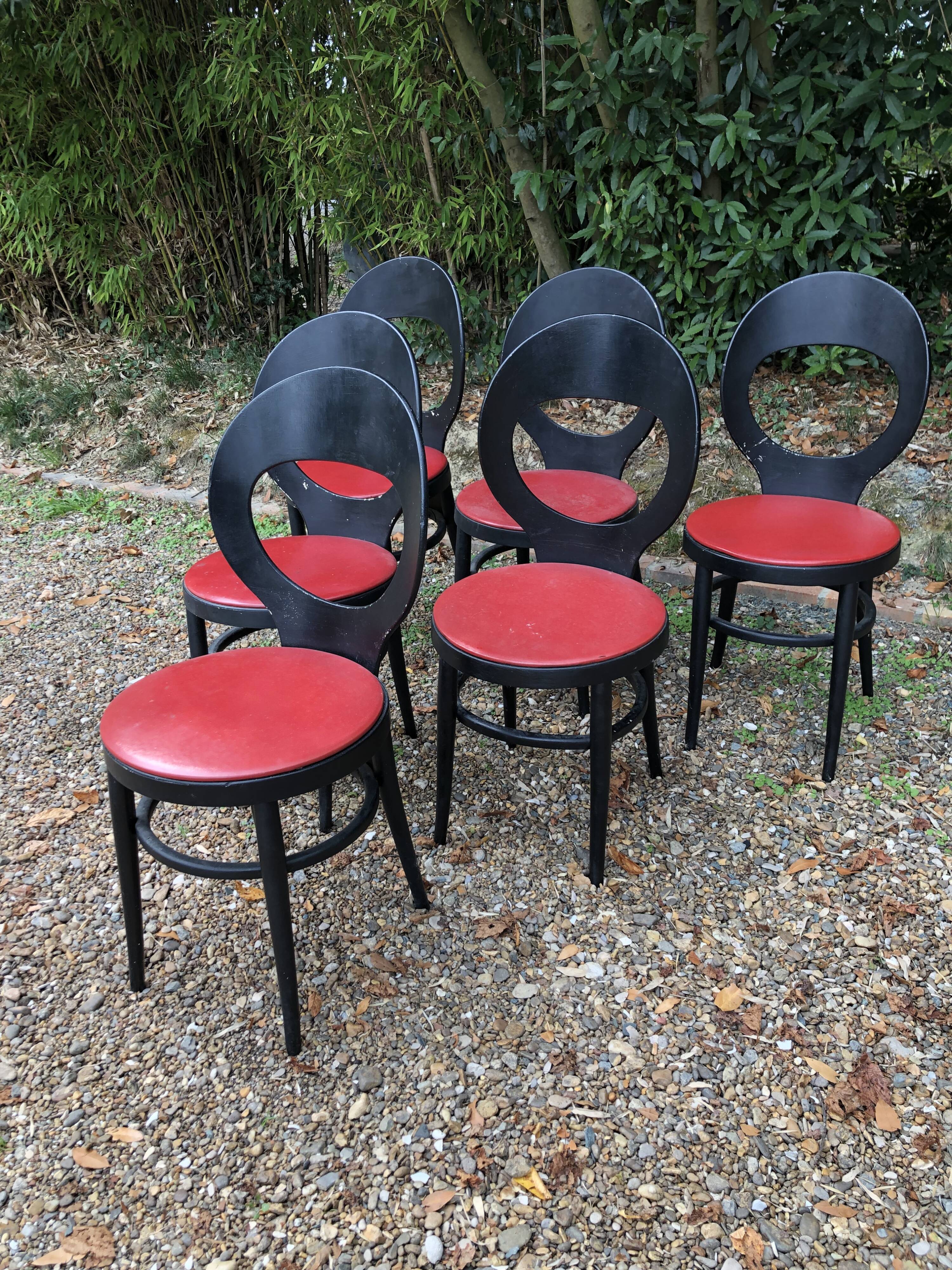 6 vintage Baumann seagull model chairs, black lacquered with red Skai seats.