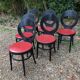 6 vintage Baumann seagull model chairs, black lacquered with red Skai seats.