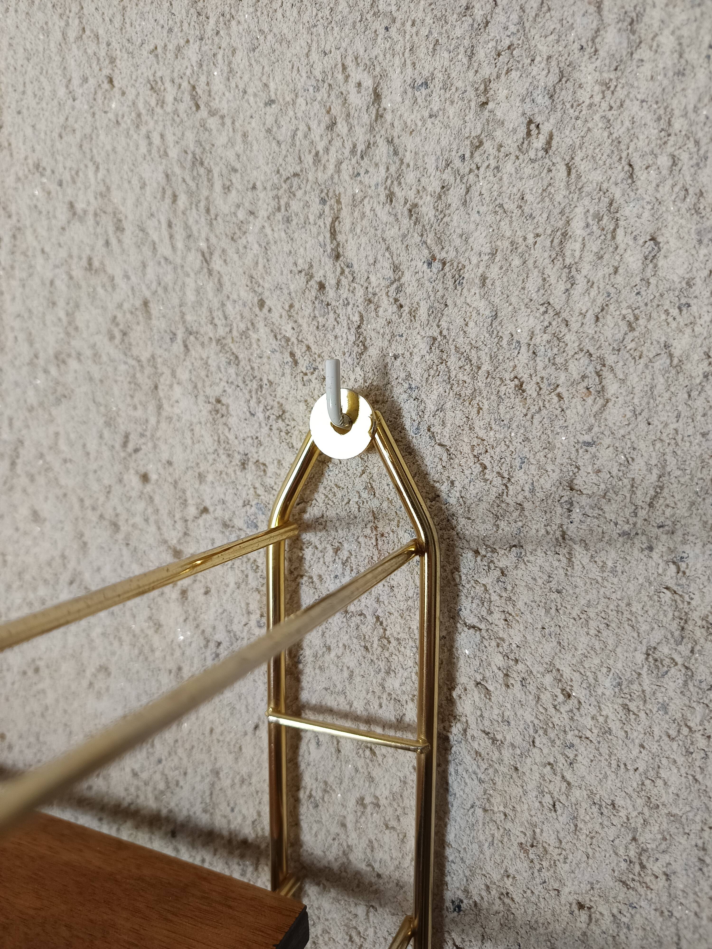 Tomado shelf, wood and gold metal.