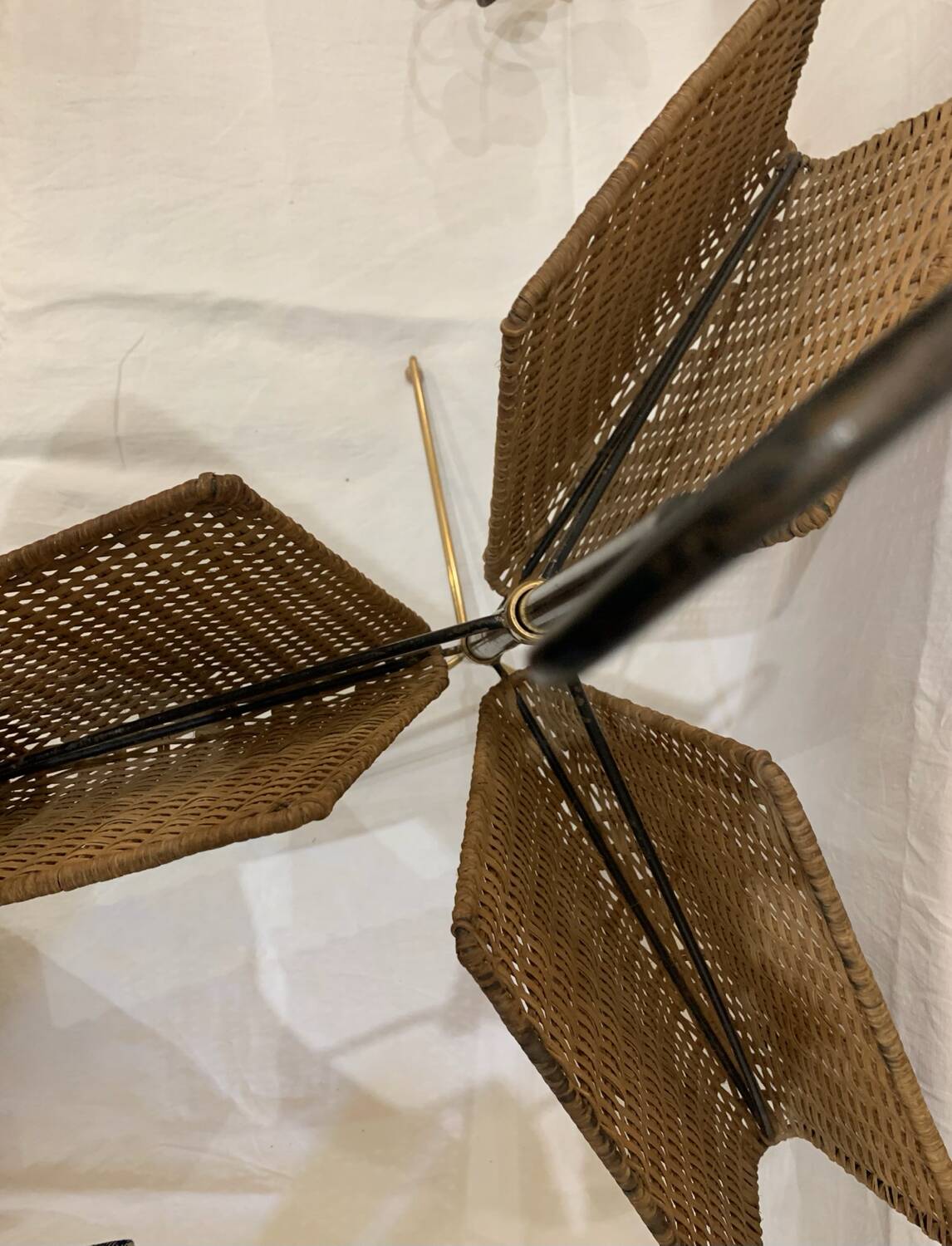 Wicker, iron, and brass magazine rack