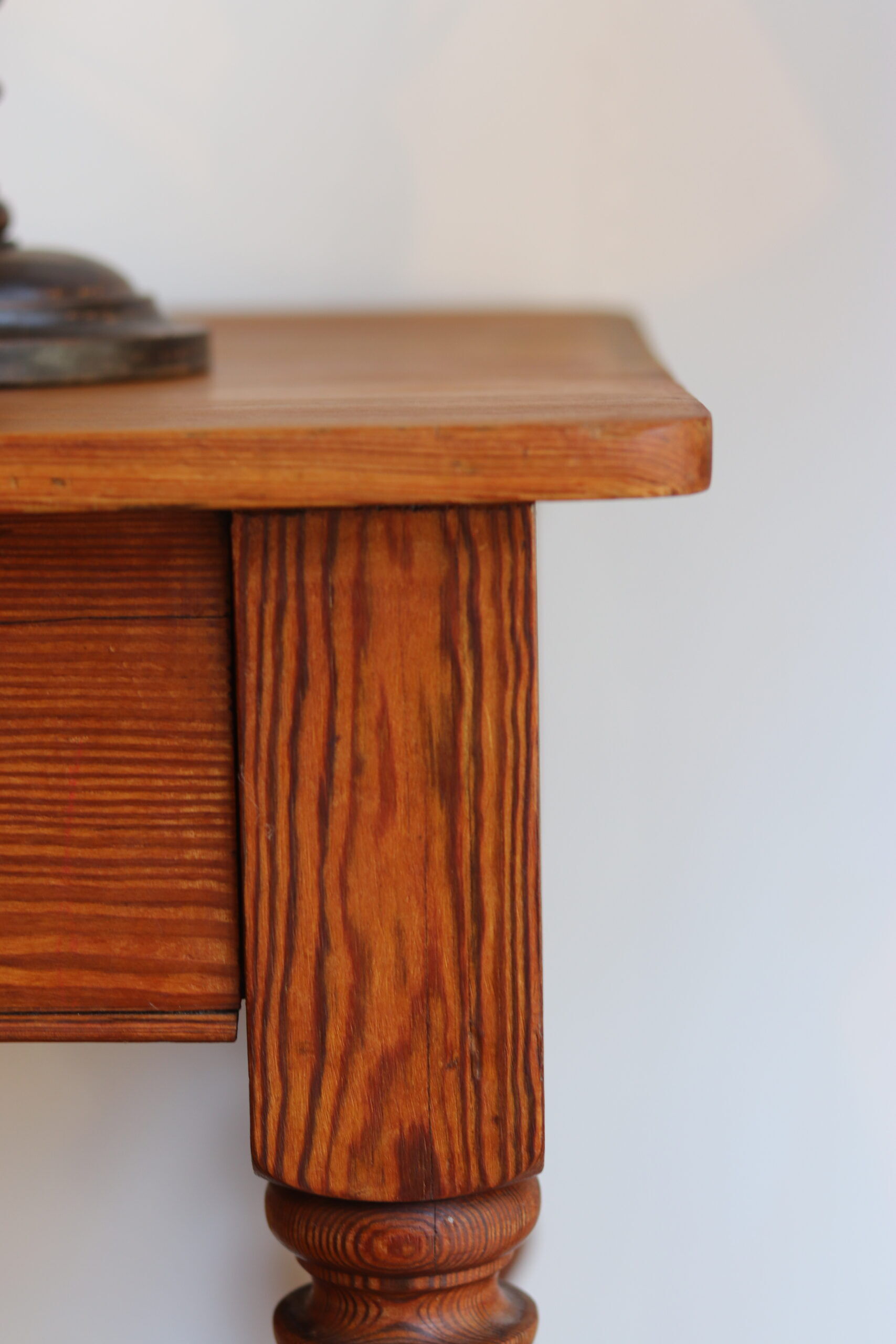 Large console or shop sideboard in pitch pine, early 20th century.