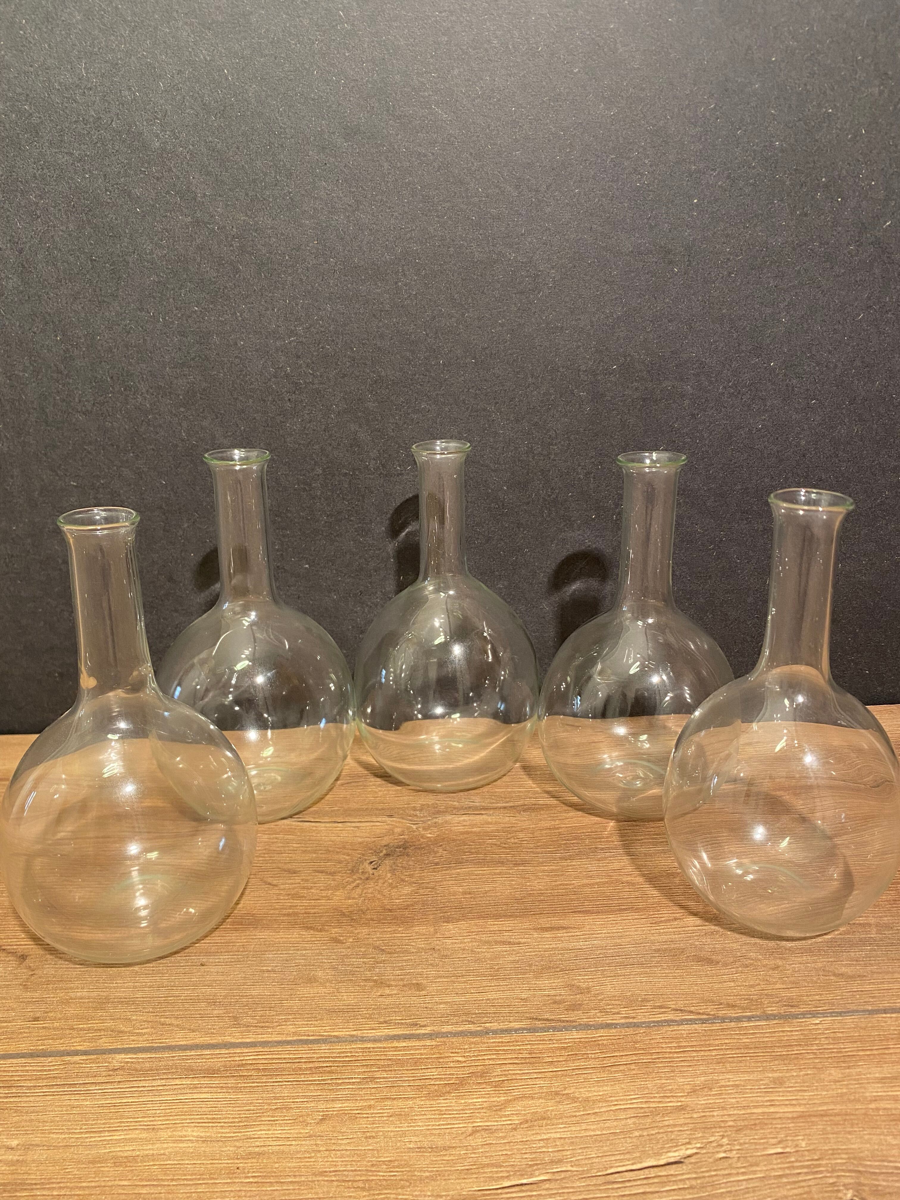 Suite of 5 bakings, bottles with long glass neck