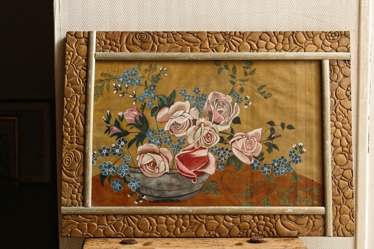 Bouquet of flowers in carved art deco frame