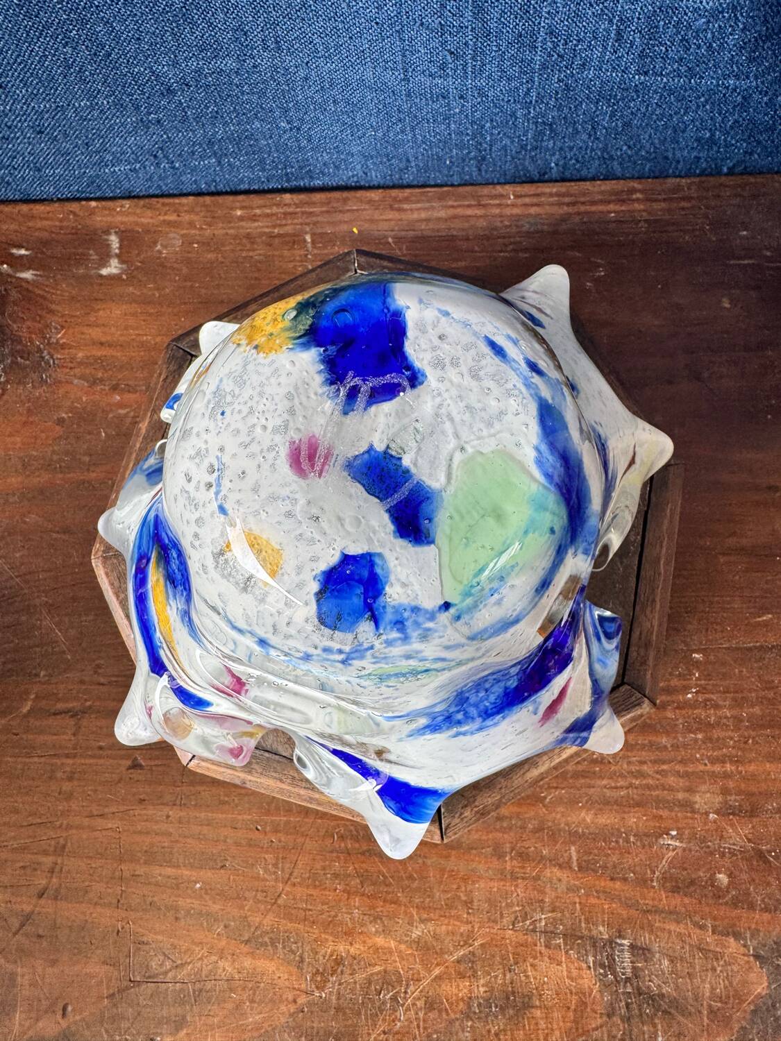 Multi-layer glass ashtray with metallic oxide inclusions.