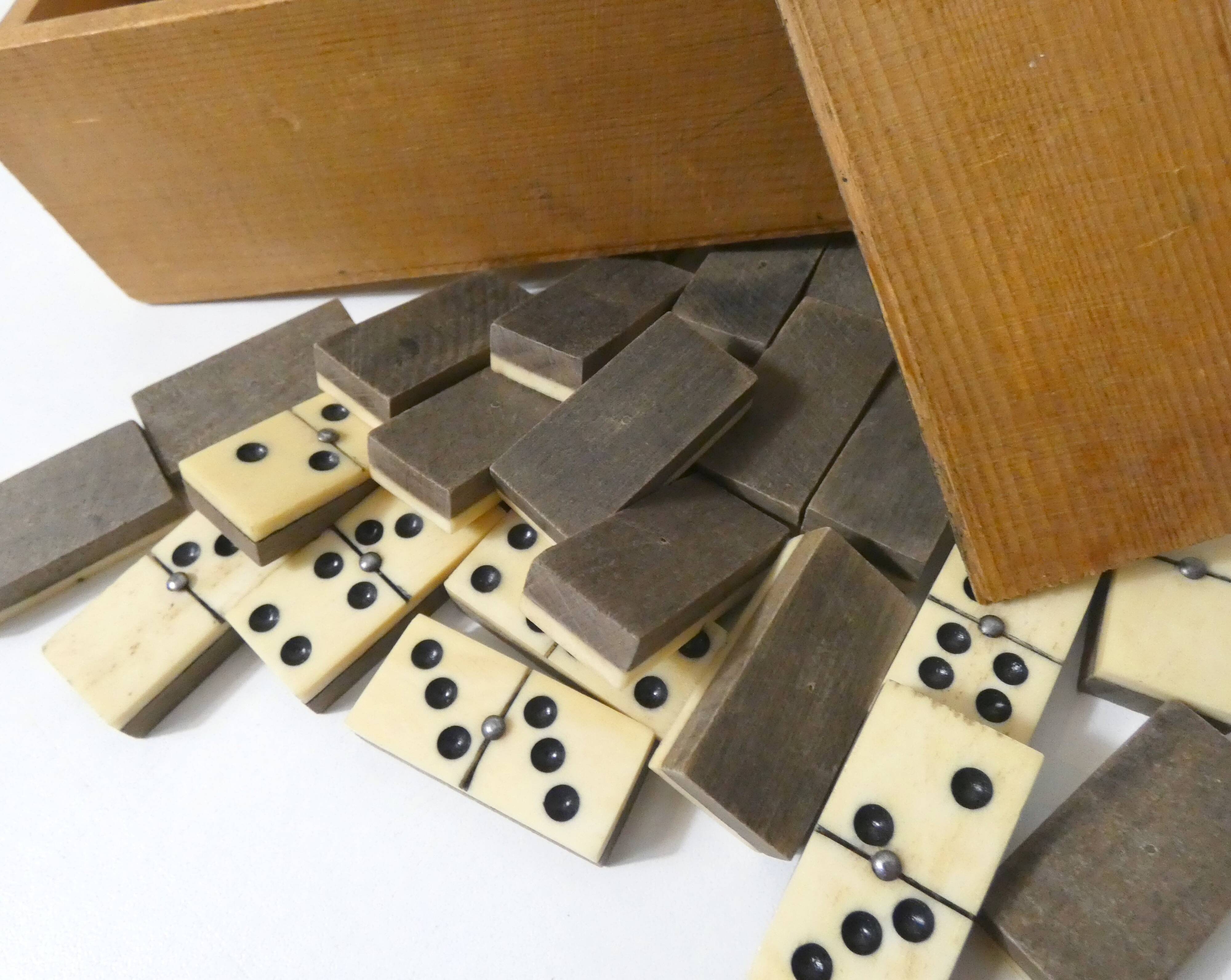 Antique set of dominoes made of bone and wood