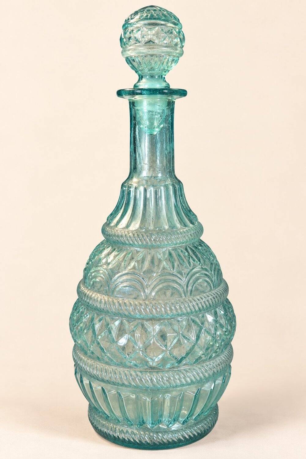Pair of cut blown glass carafes in blue-green from the 19th century.