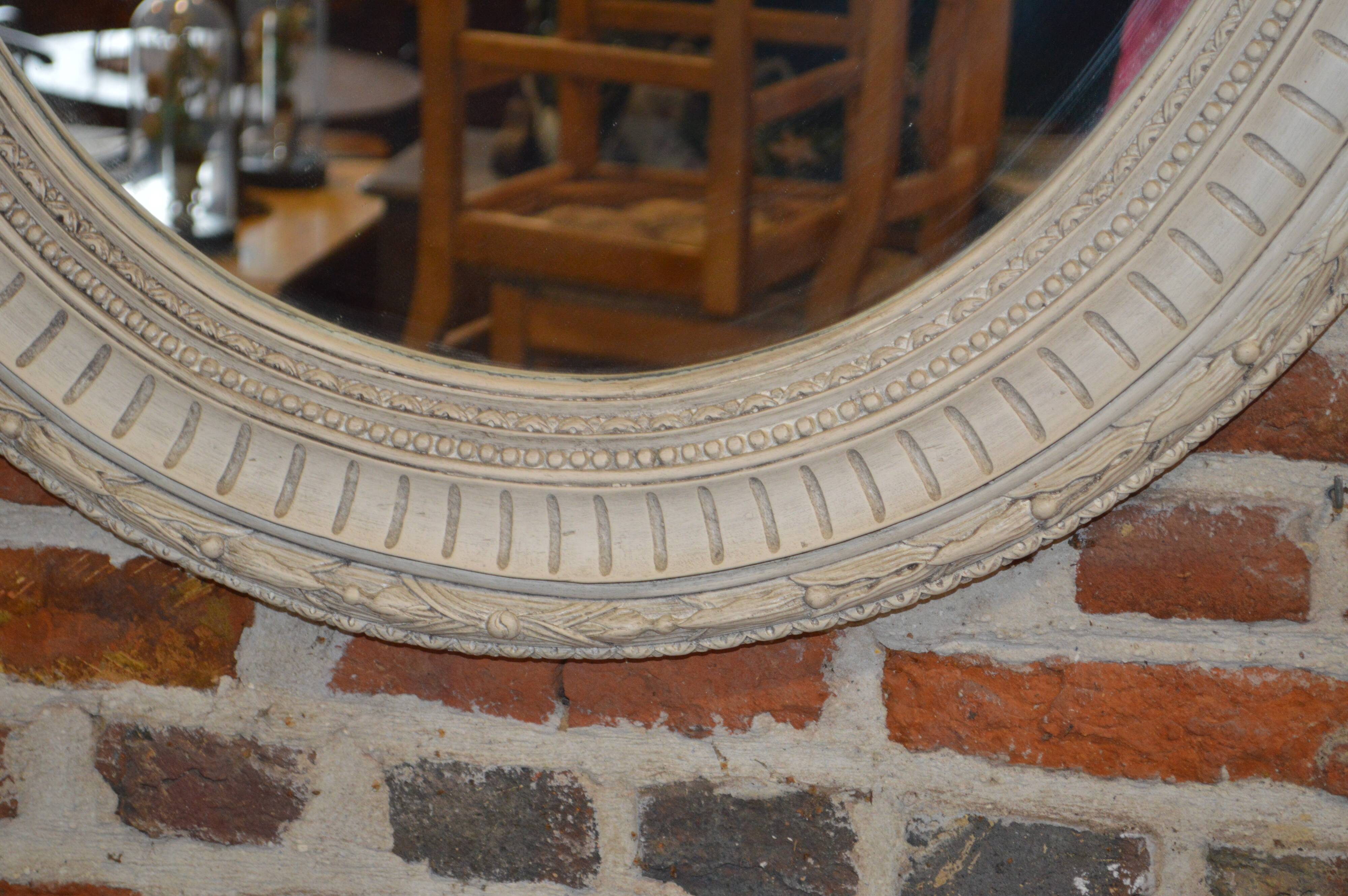 white patinated oval mirror with a bow and roses  88x115cm