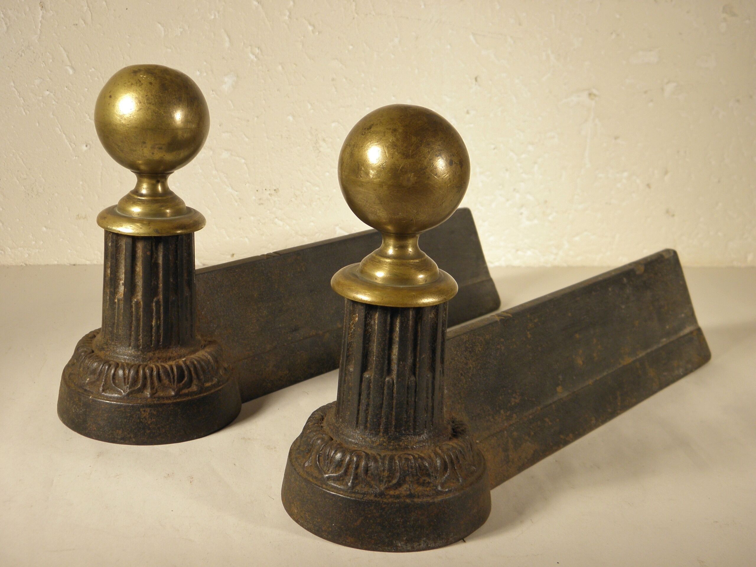 Pair of cast iron and brass chenets