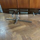 70s design oval coffee table in smoked black glass with chrome legs.
