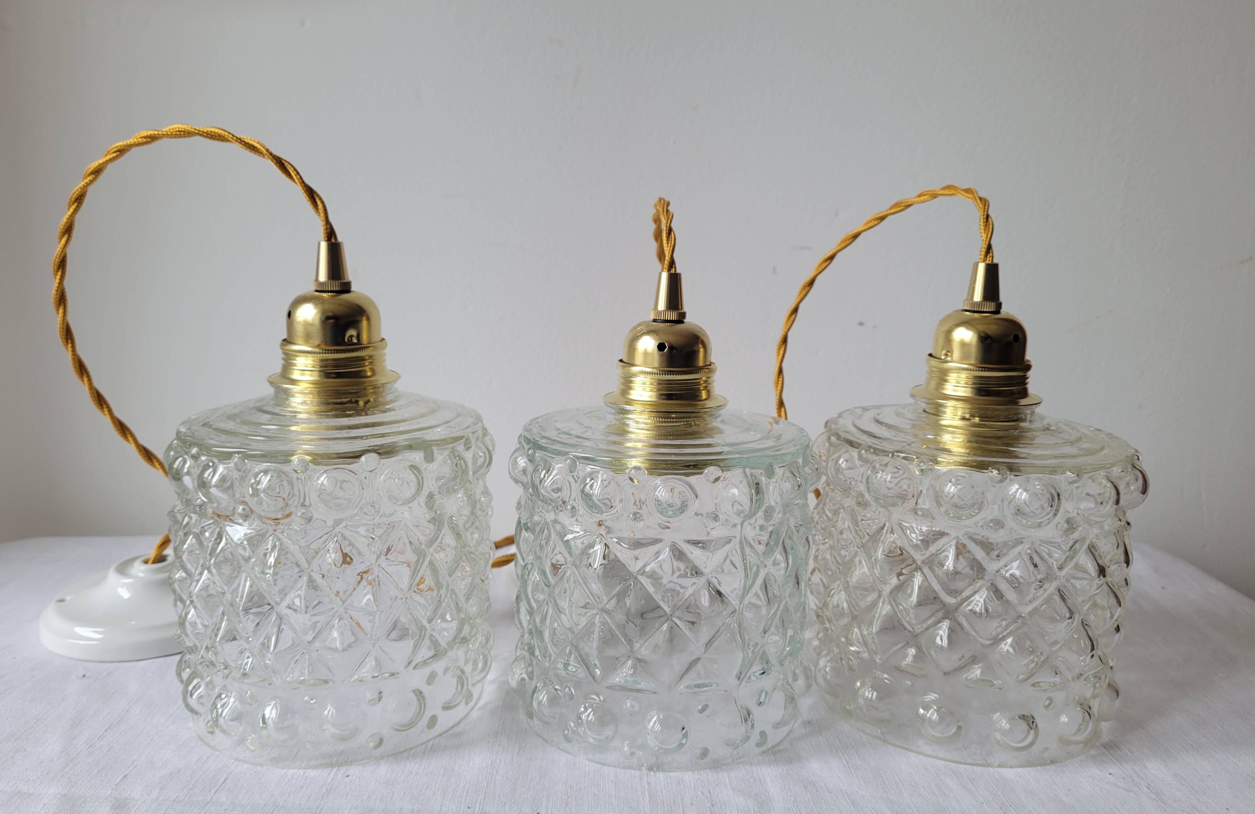 Trio of molded glass pendant lights