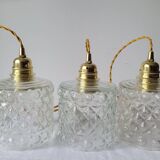 Trio of molded glass pendant lights