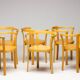 Stackable chairs in curved beech.