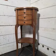 Oval bedside table in Louis XV style made of mahogany.