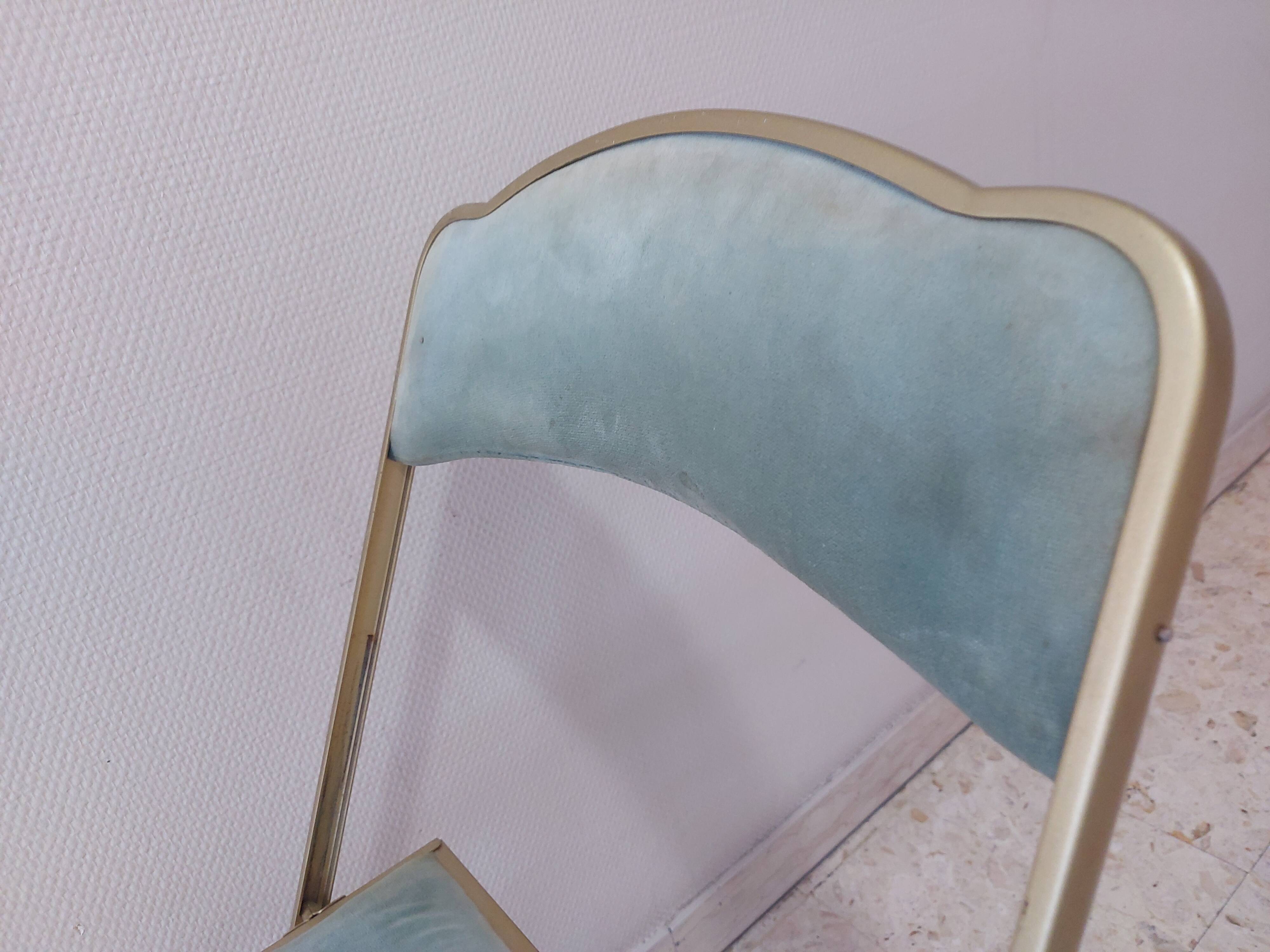 Two folding opera chairs in velvet