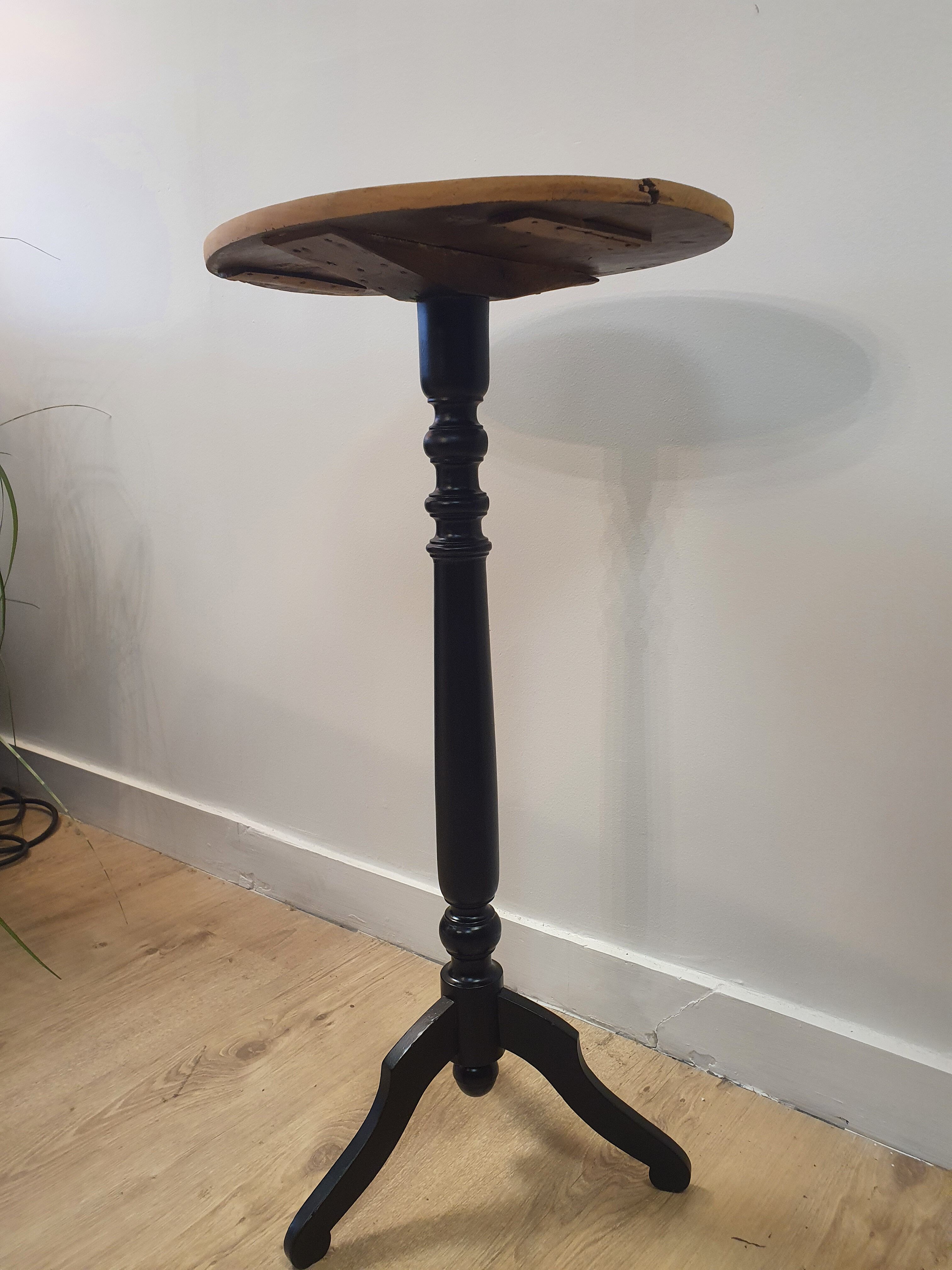Black and wood pedestal table