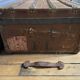 Large antique trunk with a key closure.
