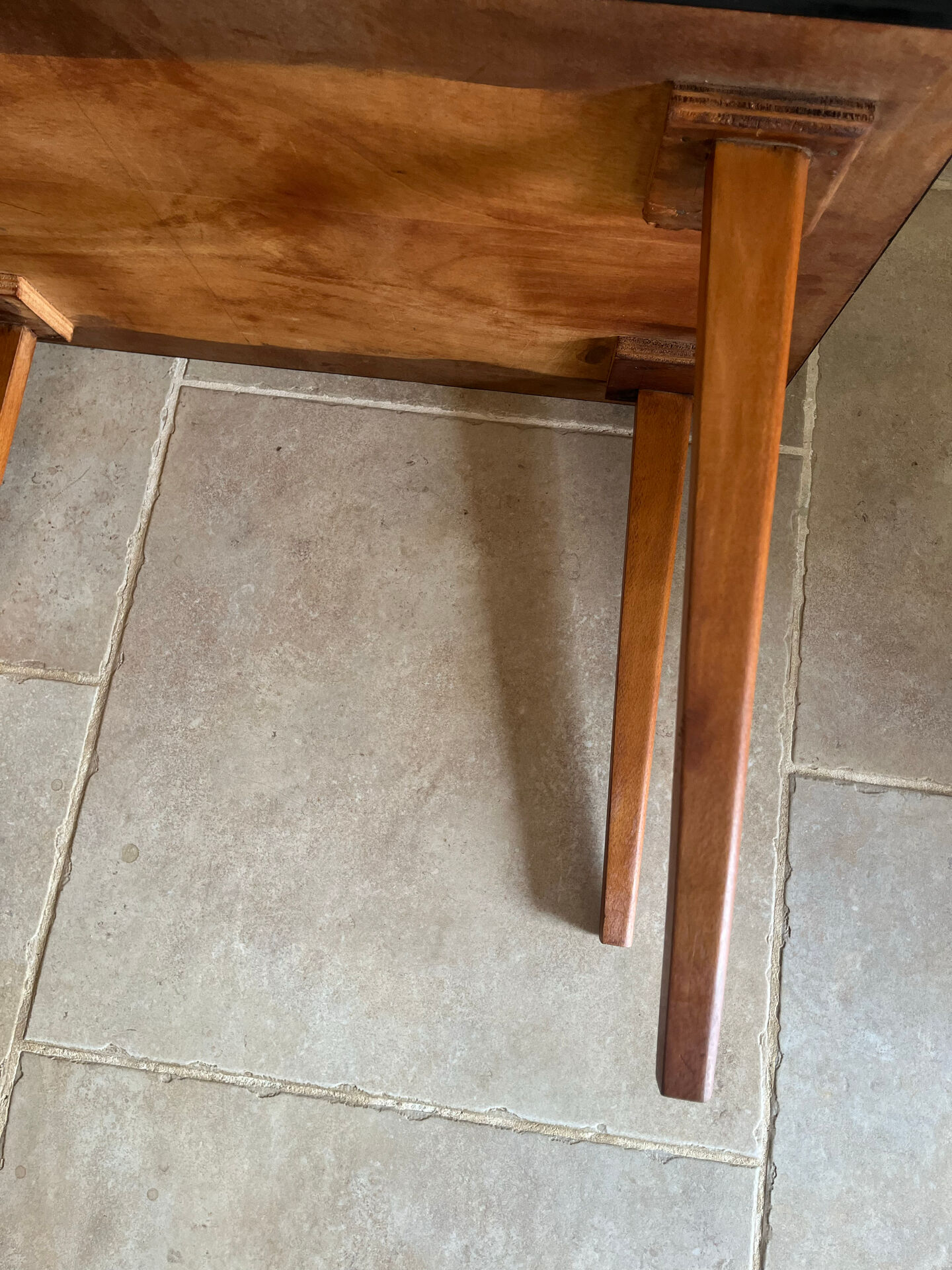 Mid-century coffee table with tapered legs.