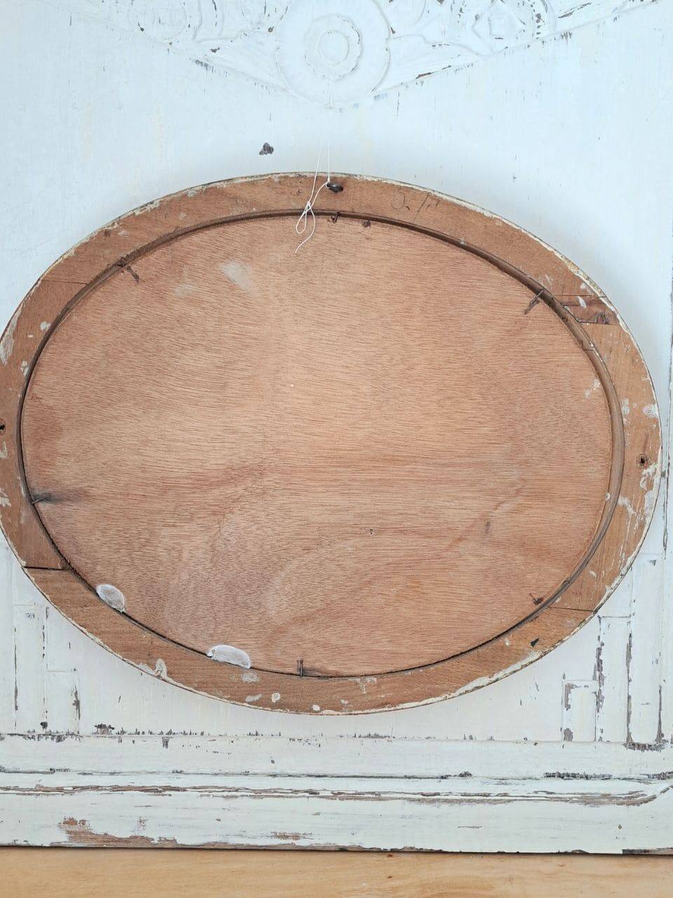 Ancient oval painting of a sleeping woman in oil on wood panel.