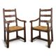 Paire de fauteuils rustiques en chêne assises paillées