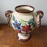 Ceramic vase with hand-painted floral decoration.