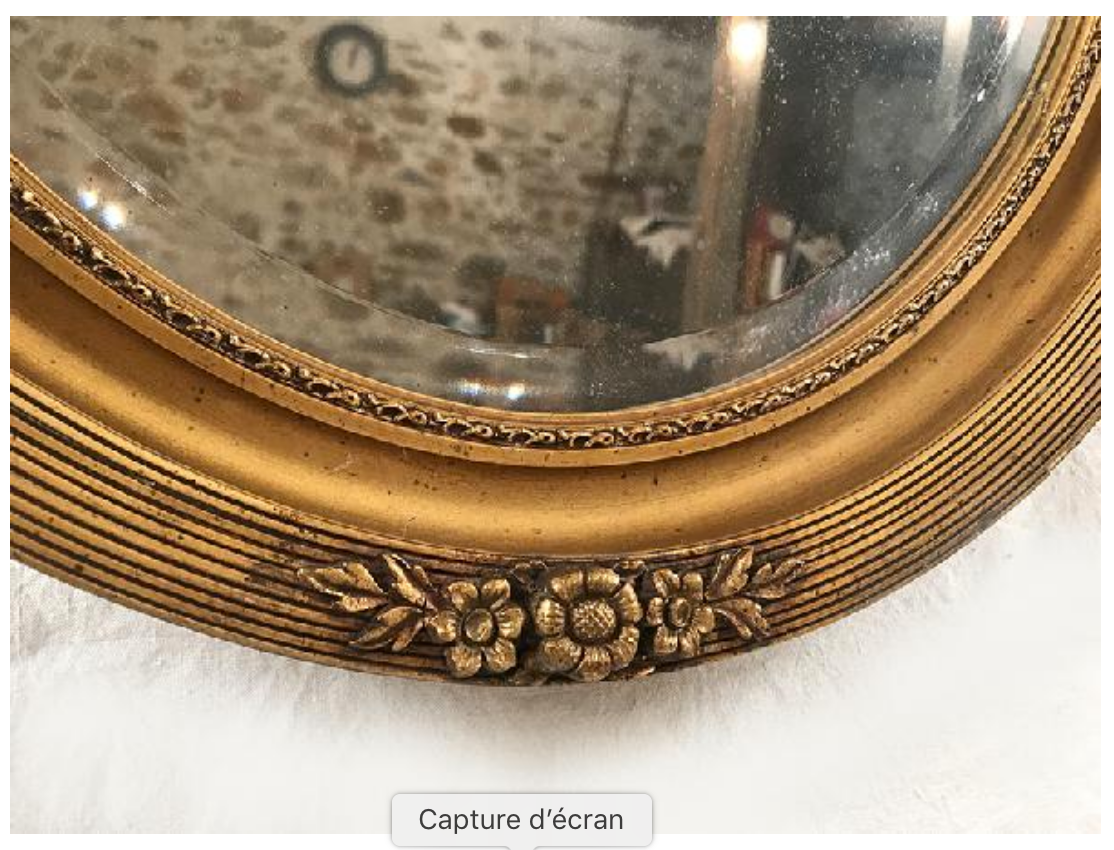 Mirror oval gilded stucco frame