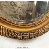 Mirror oval gilded stucco frame