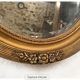Mirror oval gilded stucco frame