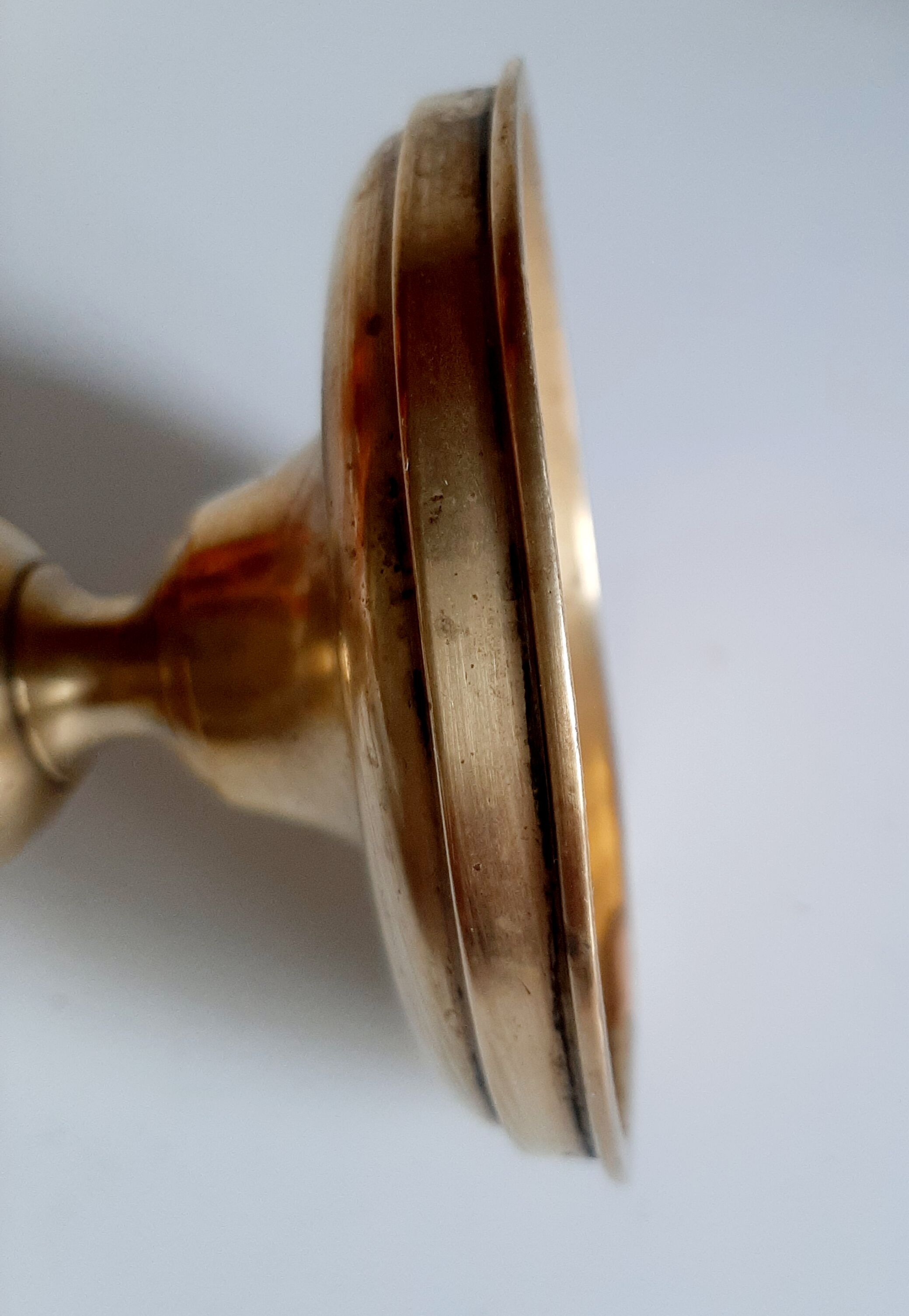 Golden brass candle holder