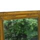Miroir français ancien à cadre doré orné de cygnes, époque de la Restauration