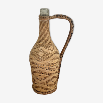 Vintage bottle dressed in wicker