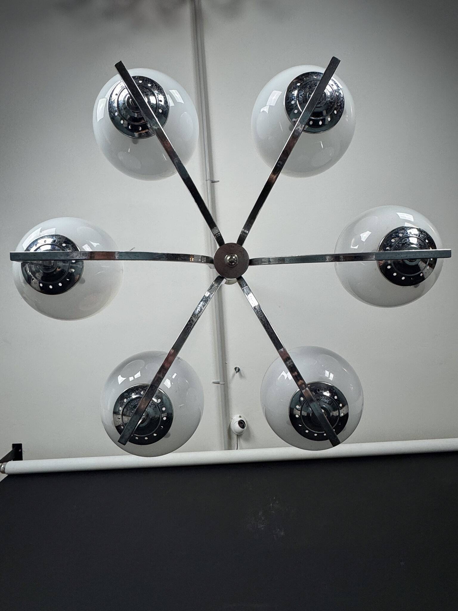 Six arms chandelier in murano glass spheres and chrome. Italy 1960s