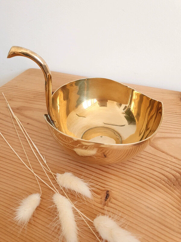 Empty brass apple pocket