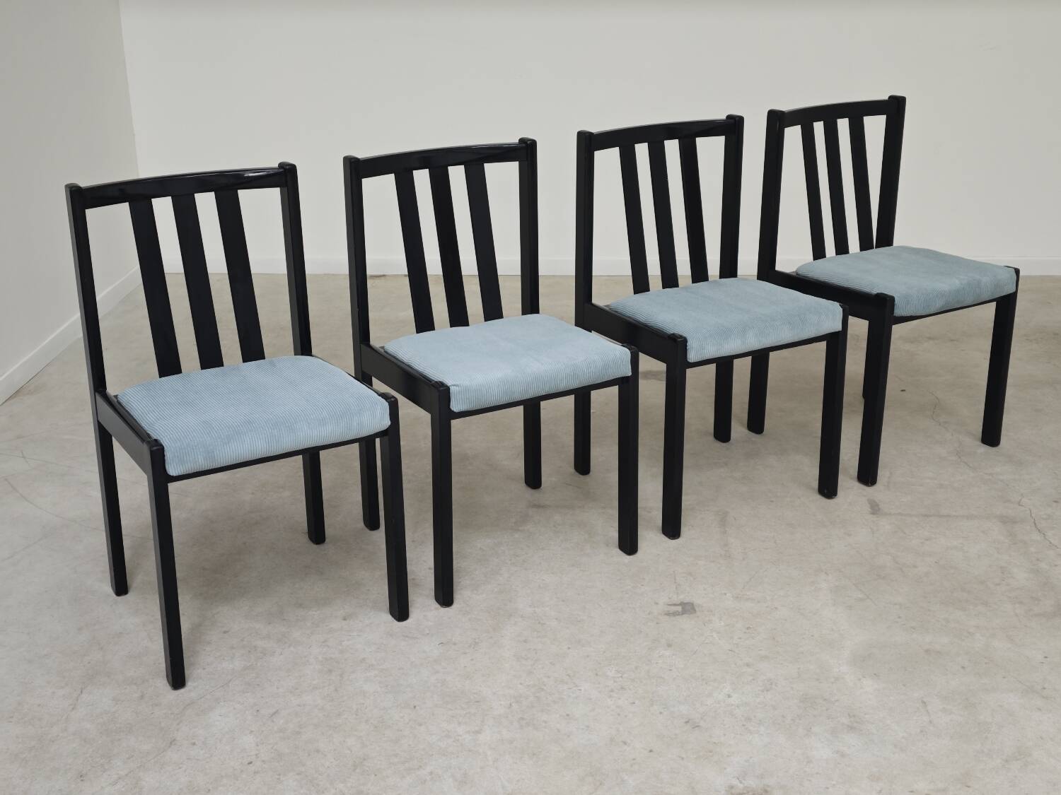 Set of 4 modernist black chairs with light blue ribbed fabric