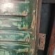 Lot of old green shutters in 4-part iron screen headboard