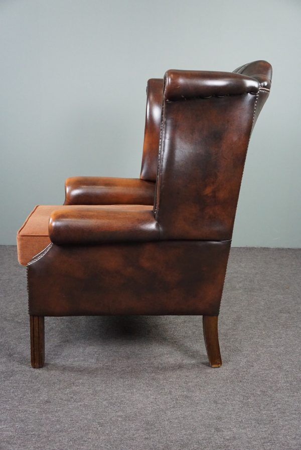 Chesterfield armchair with armrests
