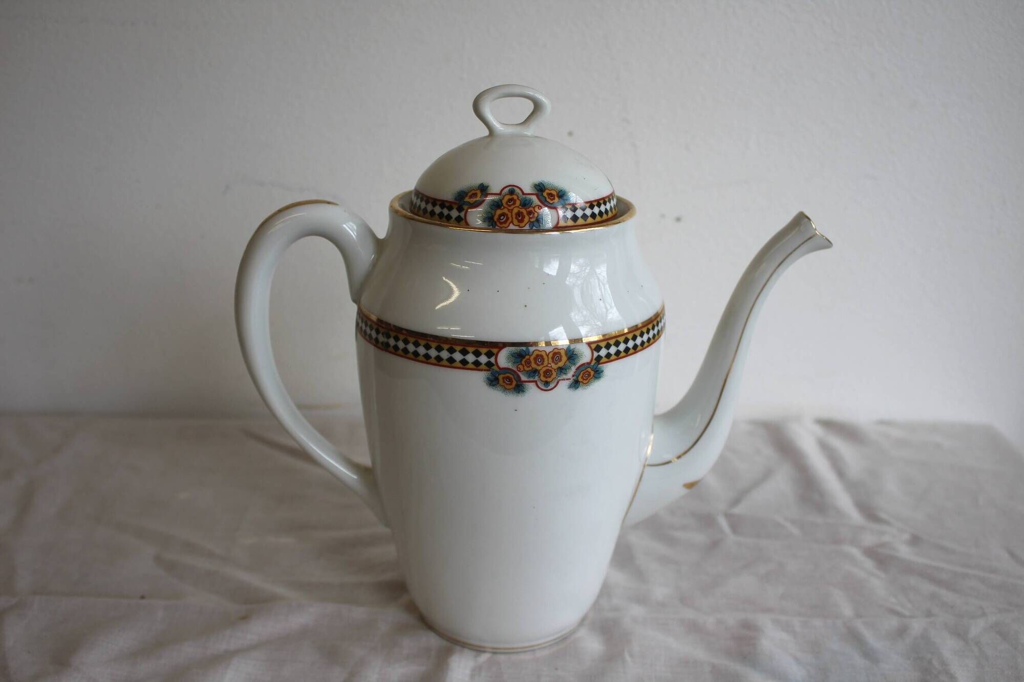 Antique coffee pot in white Limoges porcelain with floral motifs
