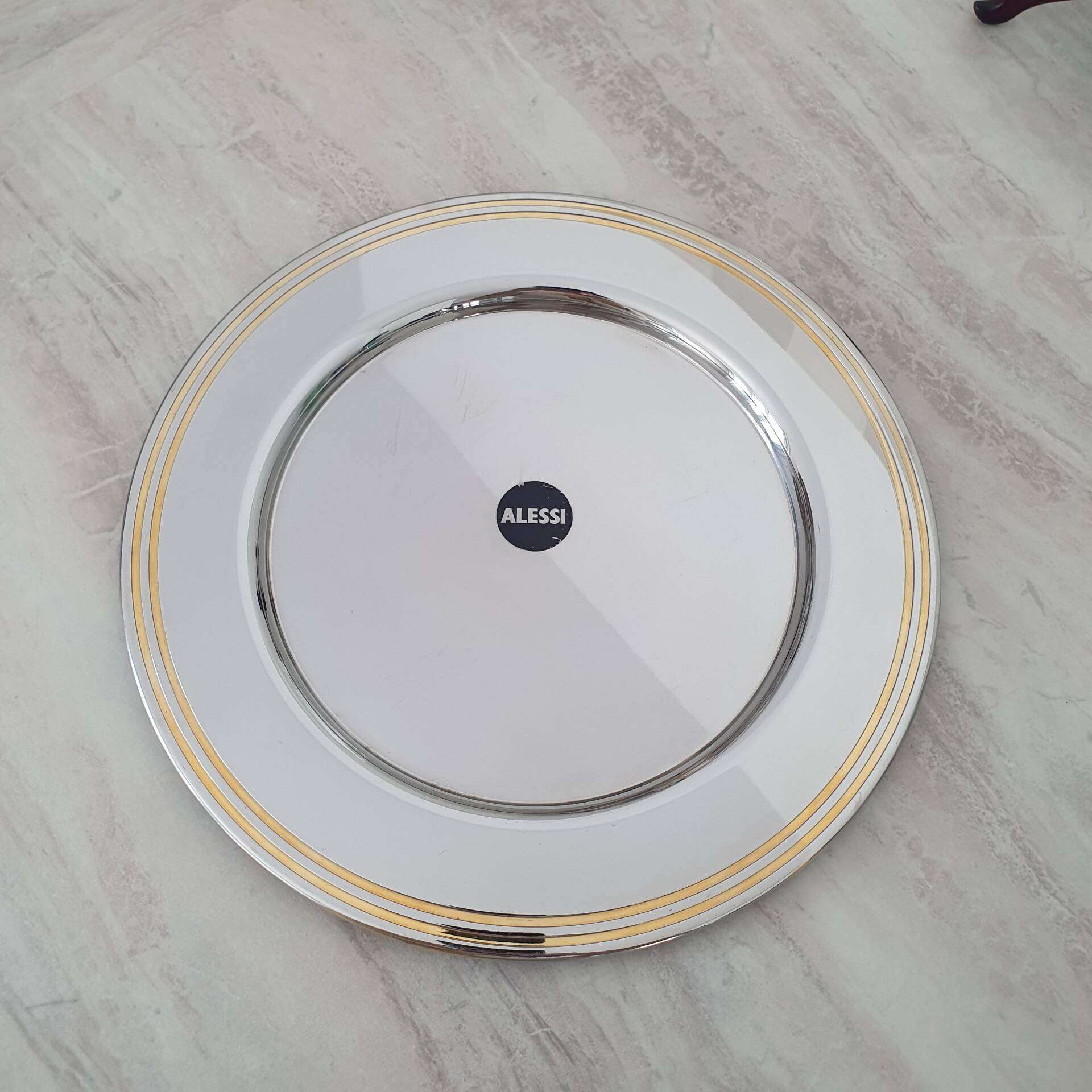 Alessi Ettore Sottsass / Assiette de service inox 18/10 et doré NG5100